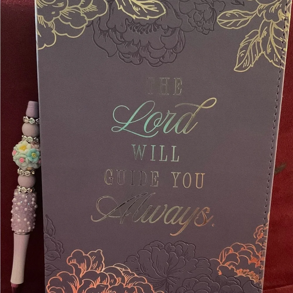Floral Embossed Purple Journal with Hand Crafted Pen. Journal is 8.5 x 5.75”